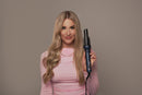 Woman holding a G&C Gold Class Auto Curler – Automatic Hair Curler for Perfect Curls